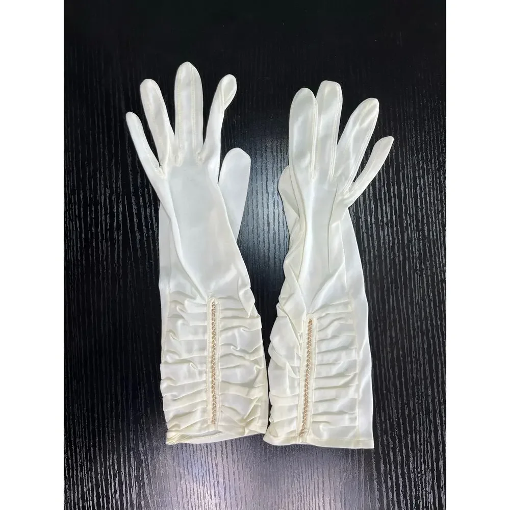 Vintage 60's era elegant long dress gloves tagged with faux pearl accents